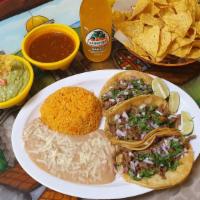 Taco Dinner · Three soft corn tortillas.  Mexican Style (onions & cilantro) or American Style (lettuce and...