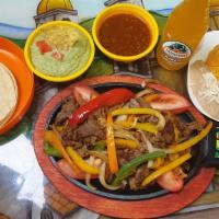 Fajitas Dinner+ · Fajitas Dinner-  All fajitas served on top of a sizzling skillet with sautéed bell peppers, ...