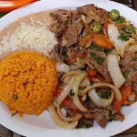 Bistek A La Mexicana · Sliced grilled seasoned steak mixed with onions, jalapenos and tomatoes. Served with corn or...