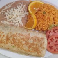 Breakfast Burrito · Breakfast Burrito -  Three scrambles eggs, cheese, beans and your choice of meat rolled in a...