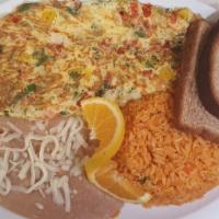 Mexican Omelet · Mexican Omelet- Three eggs, chorizo, cilantro, onion, jalapenos and avocado. Served with hom...