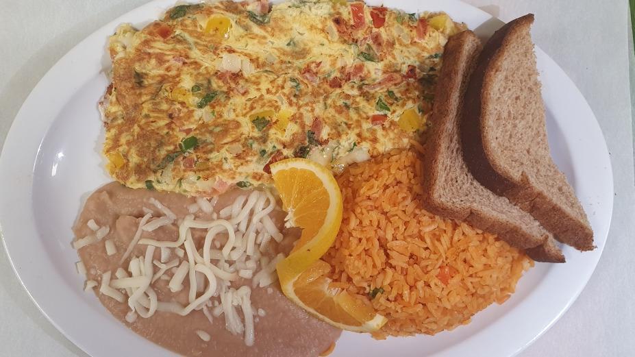 Mexican Omelet · Mexican Omelet- Three eggs, chorizo, cilantro, onion, jalapenos and avocado. Served with homemade green or red tomatillo salsa.