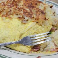 Meat Lover'S · Diced Ham, Bacon, Sausage & Cheddar Cheese, Layered Over Hash Browns & Topped With 2 Eggs