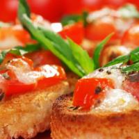 Bruschetta · Grilled Italian bread with mozzarella, tomatoes, onions, a touch of garlic and basil drizzle...