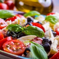 Caprese Salad · Beef steak, tomatoes, fresh mozzarella, basil and olive oil.