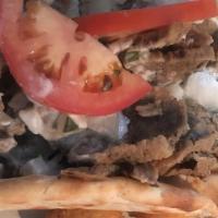 Gyro · Popular. Served with traditional creamy cucumber sauce, lettuce, onions and tomatoes on a fl...