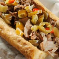 Chicago Style Italian Beef · Roast beef Served on a French roll dipped in au jus gravy with hot giardiniera and American ...