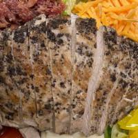 Cobb Salad · Fresh romaine and iceberg lettuce, marinated grilled chicken breast, crispy smoked bacon, ju...