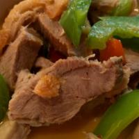 Gang Phed Ped Yang · Boneless duck cooked with red curry paste, cherry tomatoes, bell peppers and basil.