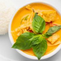Gang Dang · Red curry paste with coconut milk, bamboo shoots, bell peppers, and basil.