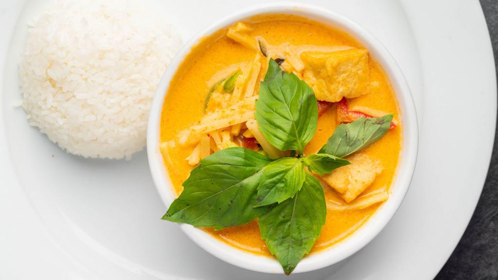 Gang Dang · Red curry paste with coconut milk, bamboo shoots, bell peppers, and basil.