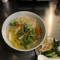 Pho · Rice noodles with chicken, chicken broth, fried garlic, scallions and cilantro. Served with ...