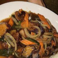 Pad Phed Eggplant · Stir fried eggplant, basil, white and green onions and carrots in a light brown sauce. (Vegen)