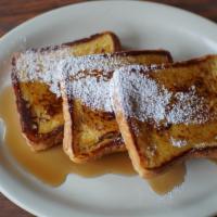 French Toast · Three pieces of Grilled, Thick French toast topped with powdered sugar. Served with whipped ...