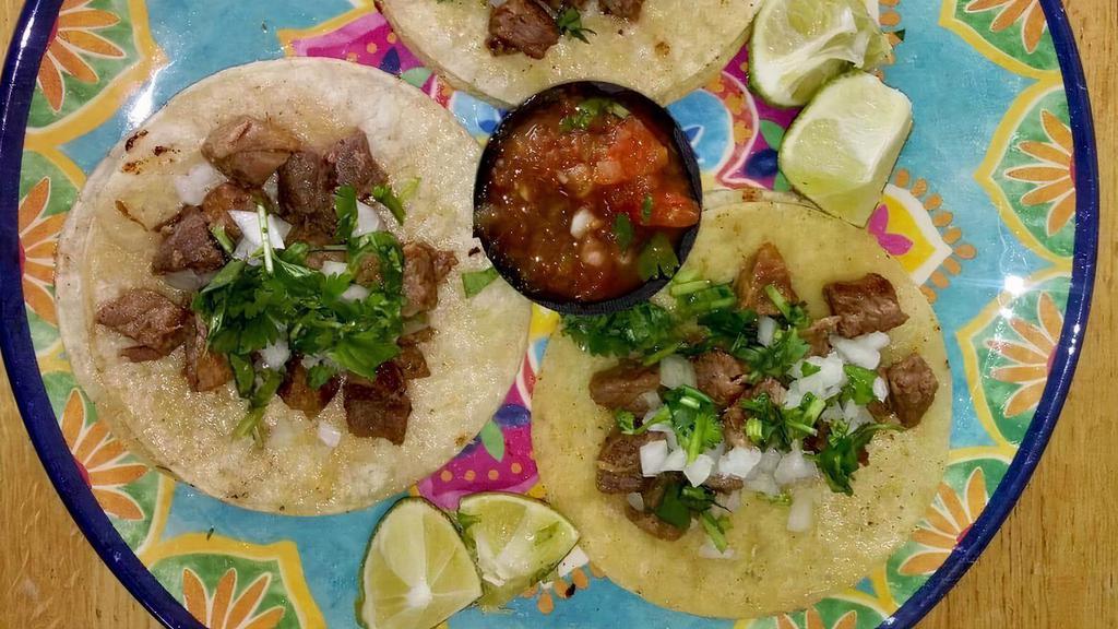 Tacos · Corn tortilla with your choice of meat, topped with cilantro, onion, and lime.