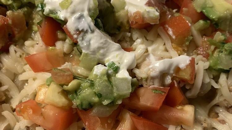 Small Deluxe Nachos · Corn chips topped with refried beans, your choice of meat, queso blanco, tomatoes, shredded cheese, guacamole, and sour cream