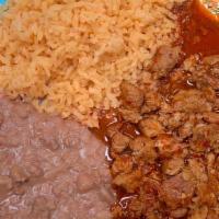 Puerco En Chile Roja · Pork in a spicy red sauce.