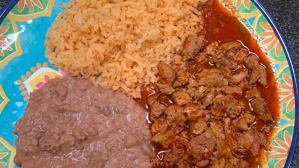 Puerco En Chile Roja · Pork in a spicy red sauce.