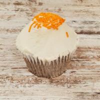 Carrot · Carrot cake topped with cream cheese icing and topped with sprinkles.