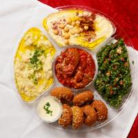Mixed Appetizers · Hummus, baba ghannouj, tabbouleh, mousaka, fried kibbeh (4 pcs).