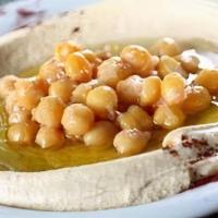 Hummus · Ground chickpeas, tahini, fresh garlic, drizzled with extra virgin olive oil and served with...