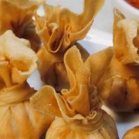 A 17. Golden Bag · Crispy golden bags filled with marinated ground shrimp and chicken served with sweet and sou...