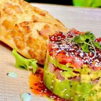 Tuna Tartare · Ahi tuna topped with fresh avocado, drizzled with sweet chili sauce, cucumber cusabi, and se...