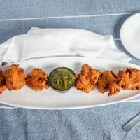 Chicken Pakora (8) · Chicken breast dipped in garbanzo batter and deep-fried.