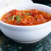 Chicken Tikka Masala · Chicken cubes cooked with fresh onion, bell pepper, and light gravy.