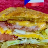 Breakfast Jibarito · Fried plantain sandwich with eggs any style, ham, lettuce, tomato, mayo, and garlic served w...