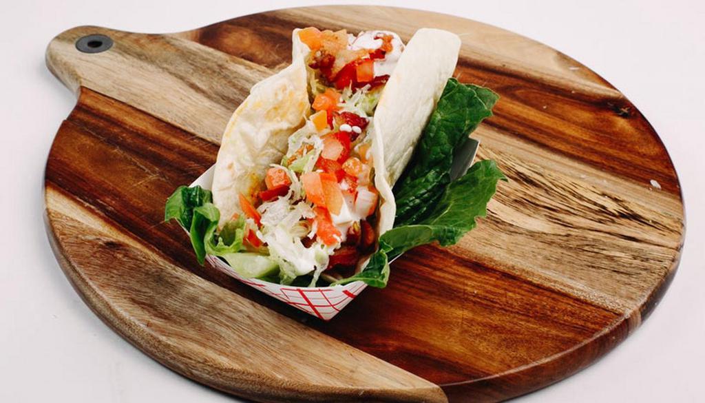 Chicken Bacon Ranch Taco · Grilled chicken served with crispy bacon, shredded lettuce, diced tomatoes and topped with buttermilk ranch