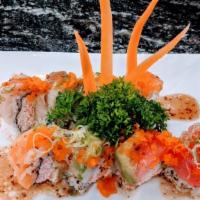 Rainbow Roll · Crab, avocado, five pieces fish, green onions, masago on top.