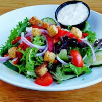 House Salad · Romaine and mixed greens, peppers, cucumbers, onions, &  queso fresco