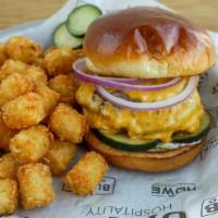 Triple Royale With Cheese* · Three 1/4 lb patties, American cheese, red onion, house pickles, and basil garlic mayo