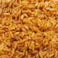 Jollof Rice · Rice style lightly spiced and cooked in flavor tomatoes sauce.