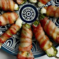 Jalapeño Poppers · Delicious Jalapeno poppers stuffed with melted Oaxaca cheese, wrapped on crispy bacon and gr...