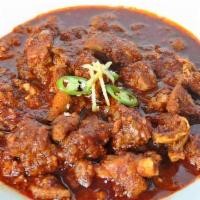 Lamb Curry Rogan Josh · Boneless lamb cubes cooked in a special onion and tomato gravy along with ginger and garlic.