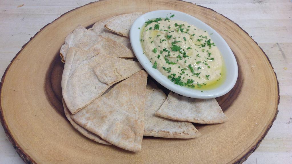 Side Of Hummus · Feeds 2 people. Comes with a bag of pita chips.