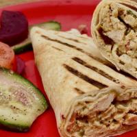 Chicken Shawarma · Marinated chicken wrapped in our freshly baked pita bread-with tahini or garlic sauce.