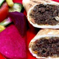 Steak Shawarma · Marinated steak wrapped in our freshly baked pita bread-with tahini or garlic sauce.