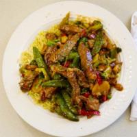 Steak Stir Fry · Stir-fried with assorted vegetables aver a bed of rice.