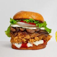 Shroom Out Chicken Sandwich · Crispy fried chicken, sautéed onions, mushrooms, melted cheese, lettuce, and tomatoes. Serve...