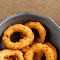 Onion Rings · Our beer battered whole onion wings provide the perfect level of crunch.