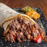 Beef Shawarma Wrap Combo · A flour tortilla with skirt beef steak, red onions, parsley, sumac mix, diced tomatoes, pick...