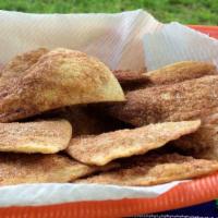 Churros Chips · Fried tortilla chips dusted with cinnamon sugar powder with a choice of hazelnut chocolate d...