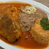 Chile Relleno Dinner · Poblano pepper stuffed with cheese, served with beans, rice and salad.