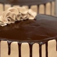 Triple Chocolate Cake · Chocolate cake with chocolate mousse, lightly iced with house-made chocolate buttercream & f...