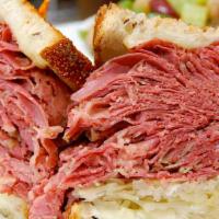 #3. Reuben · Grilled rye with Corned beef, Turkey or Pastrami , with Sauerkraut, Swiss cheese, Russian dr...