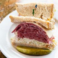 #6. Soni · Corned beef or Pastrami on rye with swiss cheese and russian dressing, coleslaw.