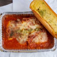Lasagna · With garlic bread. Includes garlic bread.